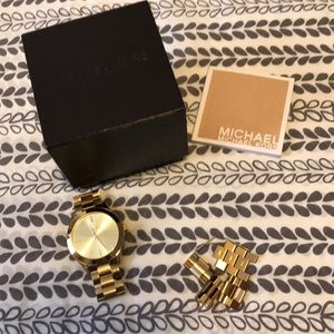 Women’s gold Michael Kors watch